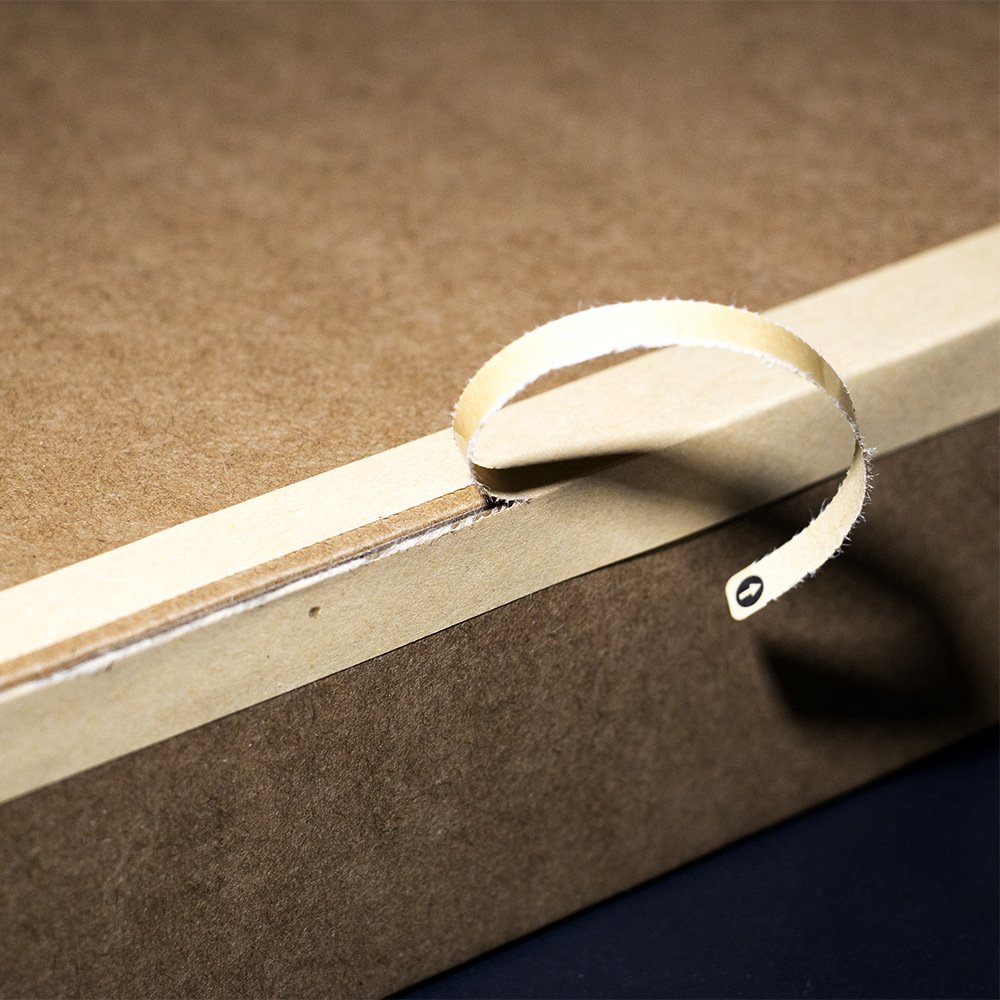 Detail view of custom kraft tear-strip sealing sticker