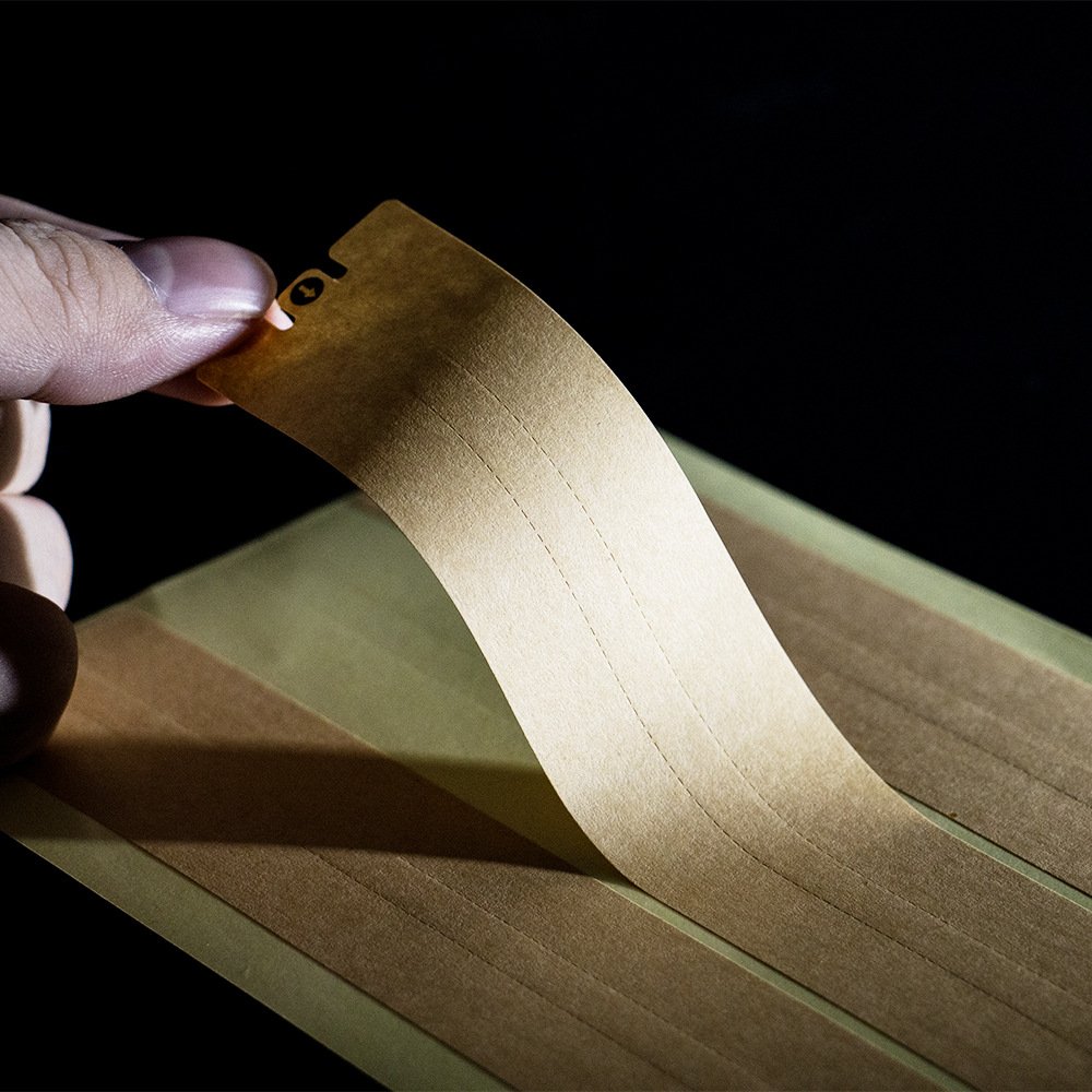 Custom kraft paper sealing sticker showing tamper-evident tear