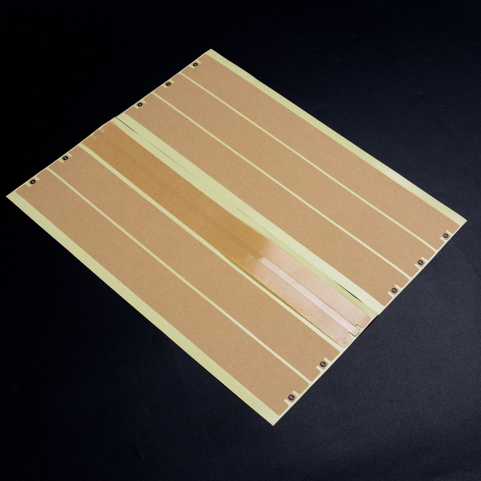 Kraft paper box sealing sticker applied across box seam