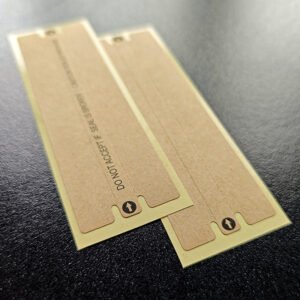 Kraft tamper seal with printed slogan applied to phone box seam
